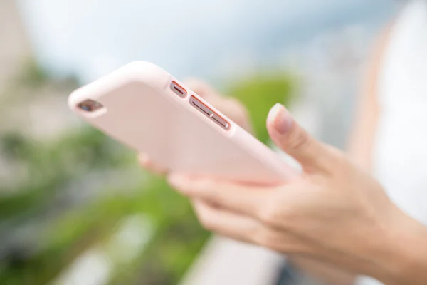 woman holding a phone